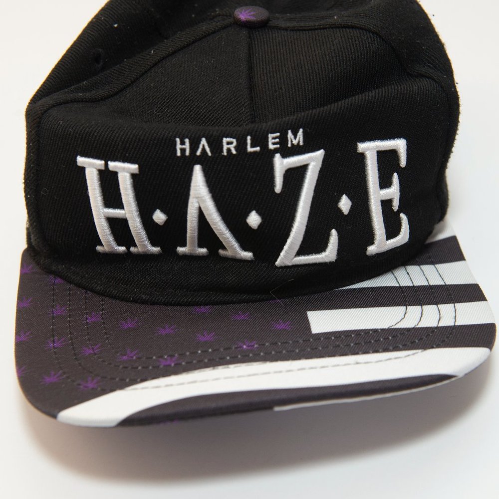 Haze Cap Black with purple cannabis plants.